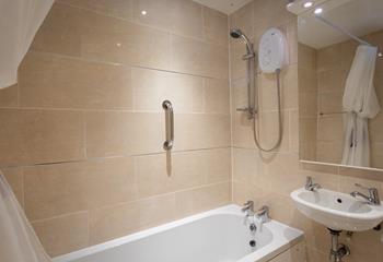 A spacious family bathroom with the option to bath or shower.