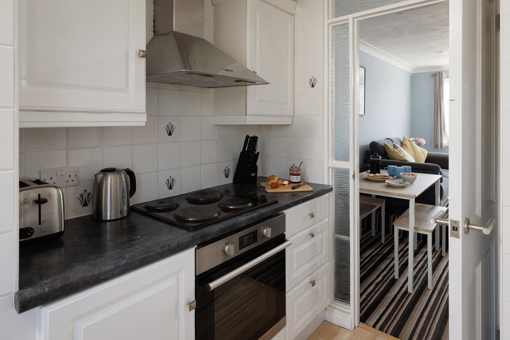 The compact kitchen is well-equipped.