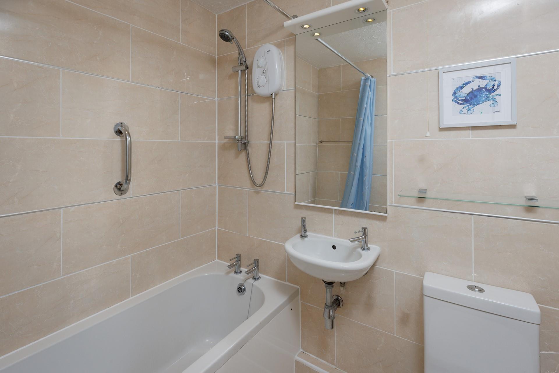 Enjoy a quick rinse or leisurely soak in the family bathroom.