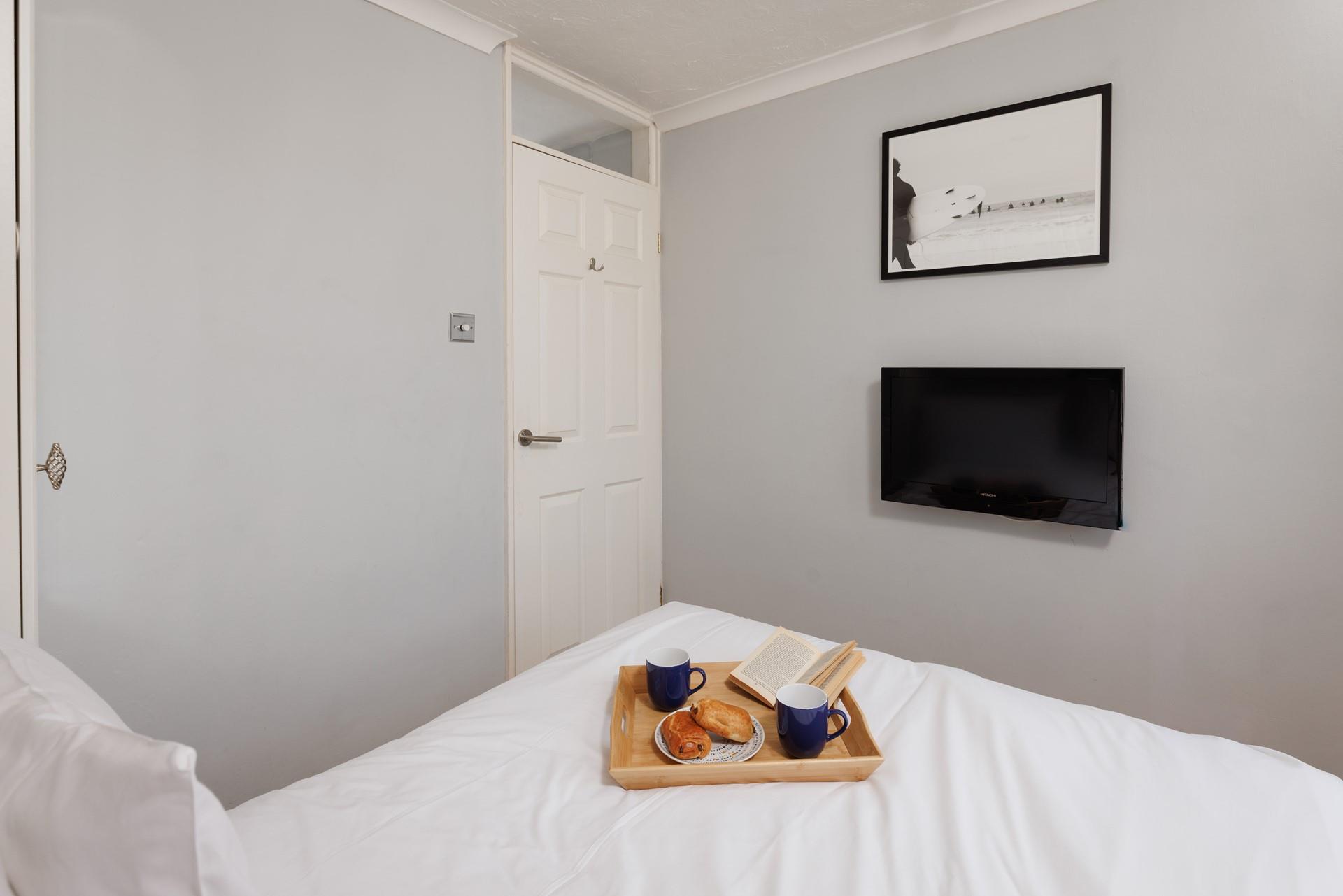 Coastal decor and a comfortable double bed make bedroom 1 a relaxing space.