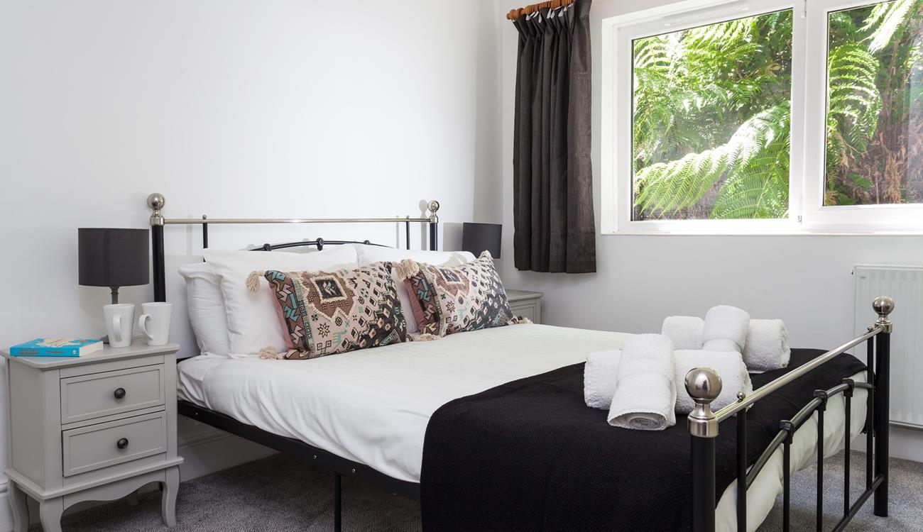 Bedroom 1 has a spacious double bed to settle into after a day on the beach.