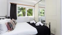 Soft sheets and fluffy towels await you in bedroom 1.