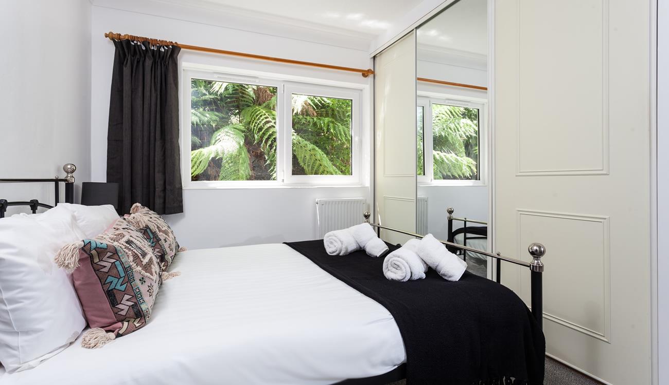 Soft sheets and fluffy towels await you in bedroom 1.