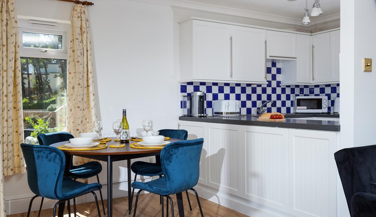 The stylish dining table is the perfect space to enjoy time together over delicious meals.