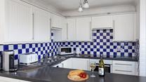 The kitchen is well-equipped for the chef of the family to rustle up culinary delights.