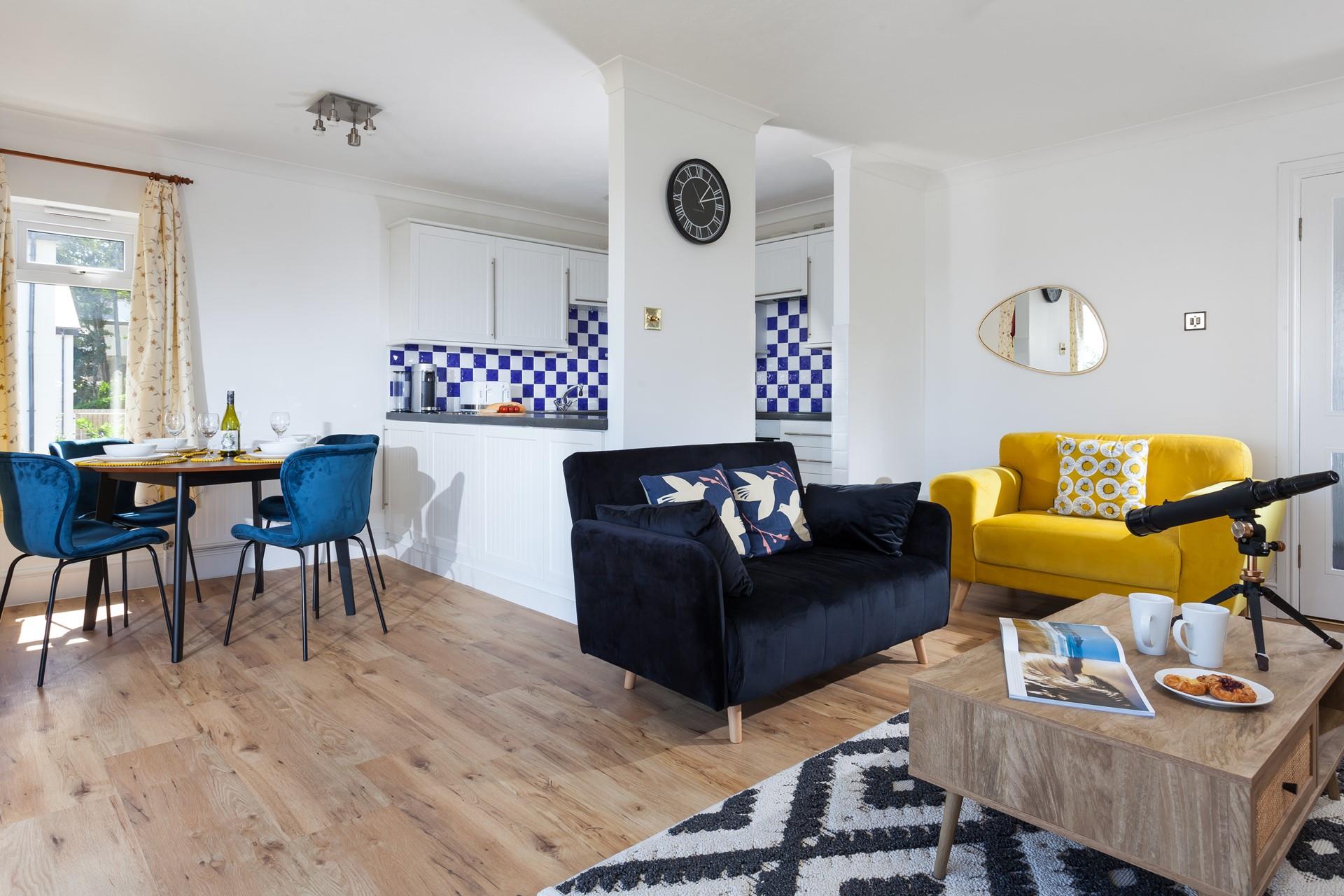 The open plan living space is modern and light to spend time together as a family.