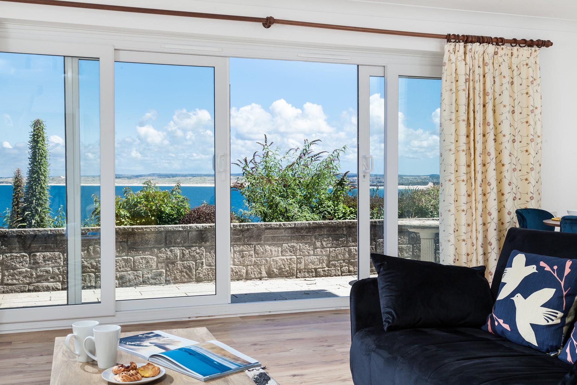 Open the patio doors and let in the fresh breeze while you enjoy the view of St Ives Bay.