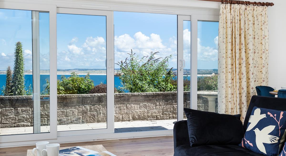 Open the patio doors and let in the fresh breeze while you enjoy the view of St Ives Bay.