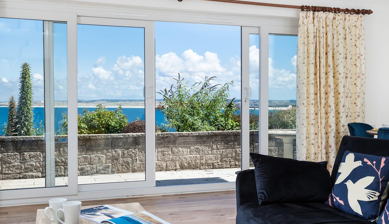 Open the patio doors and let in the fresh breeze while you enjoy the view of St Ives Bay.