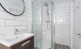 Wash off your sandy toes in the modern bathroom. - Thumbnail Image
