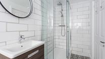 Wash off your sandy toes in the modern bathroom.