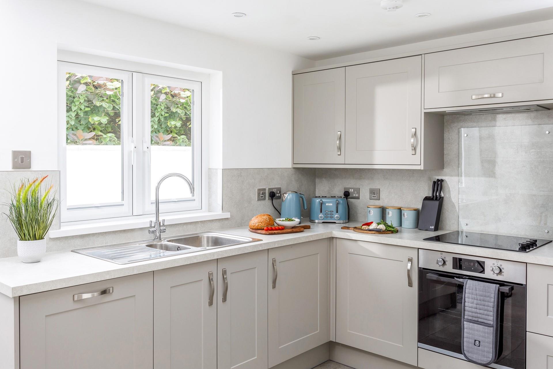 The kitchen is modern and well-equipped for the chef of the family to cook up a storm.