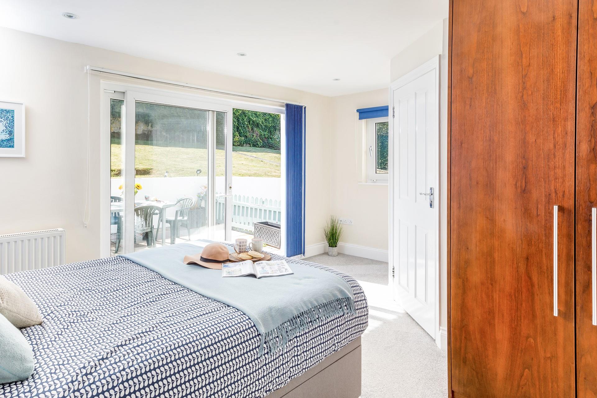 Bedroom 1 has sliding doors out to the patio area, wake up and wander out to check on the weather.