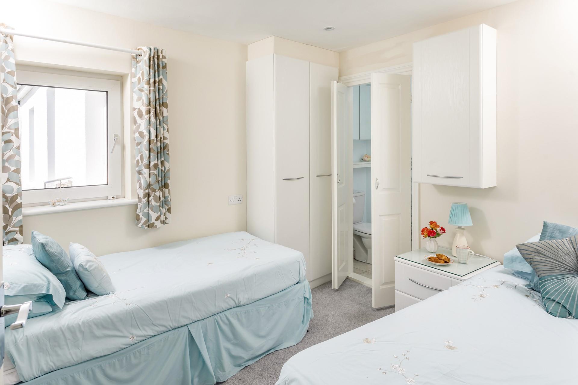 Twin beds in bedroom 2 offer a comfortable night's sleep for children or adults.