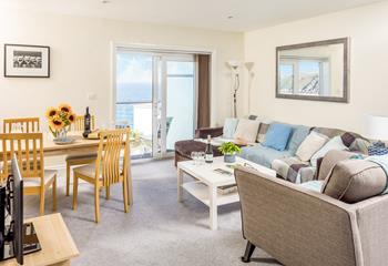 The living space is open plan so you can dine and then relax on the sofa.