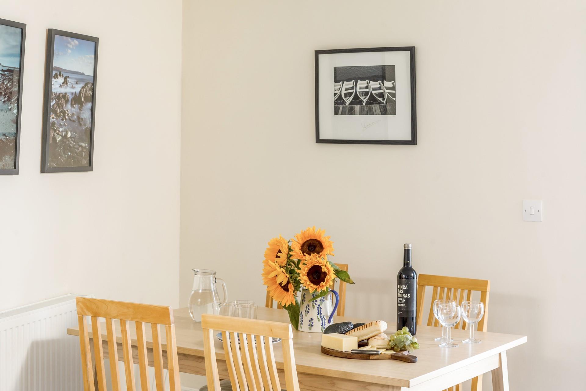 Sit around the table and tuck into a delicious meal after a day of walking the coast path.