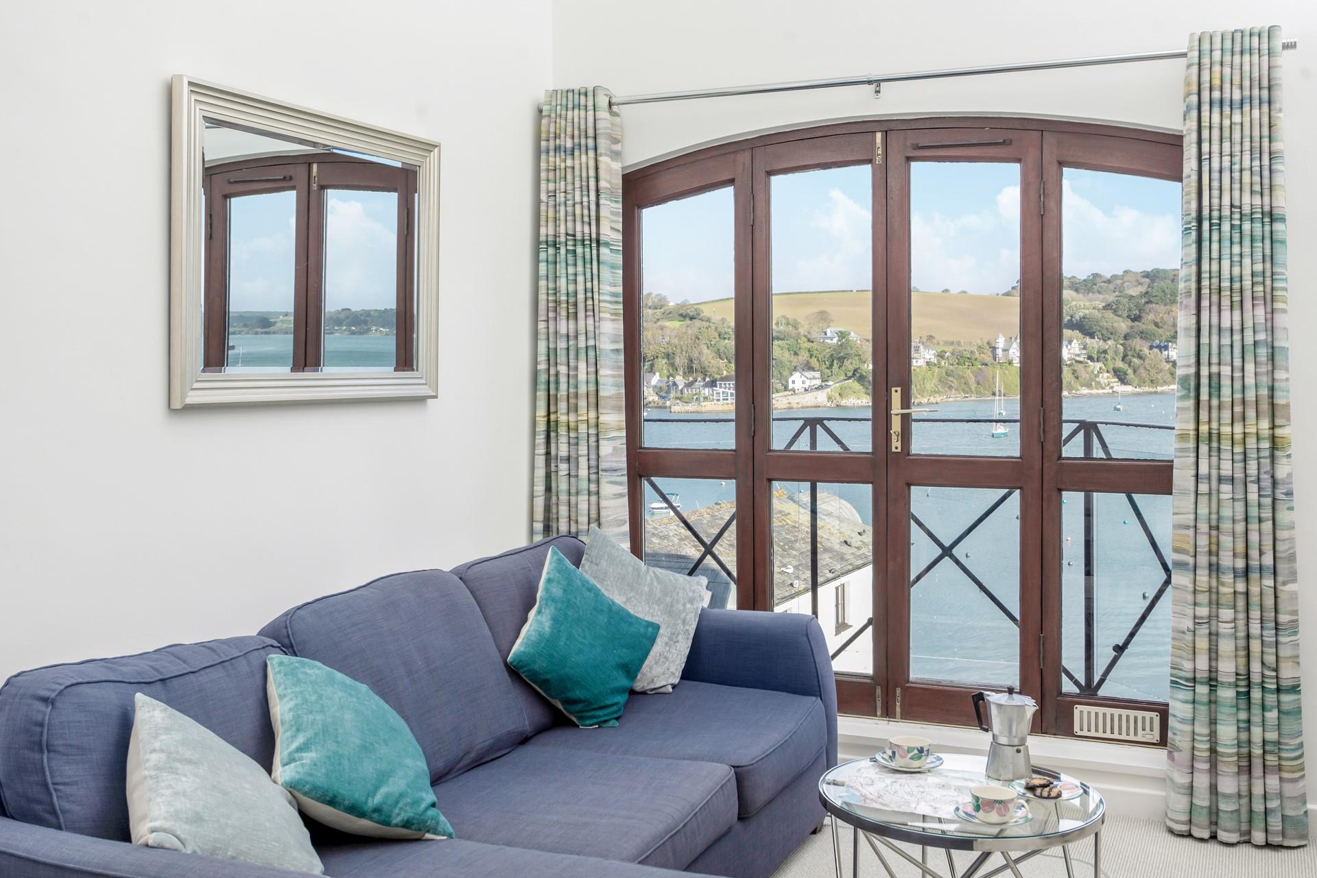 Enjoy the sea air from the comfort of the sumptuous sofa.