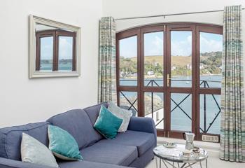 Enjoy the sea air from the comfort of the sumptuous sofa.