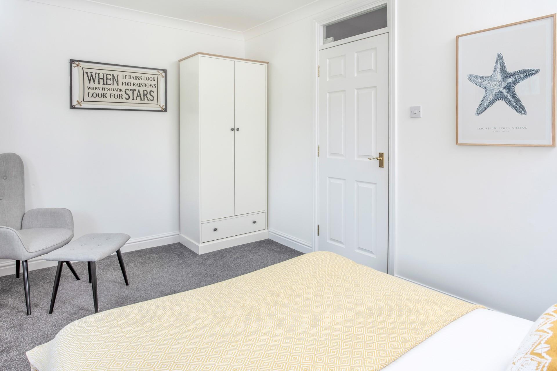 Seaside artwork reflects the location with the coast a few steps away.