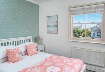 We love the coral theme in the second bedroom.