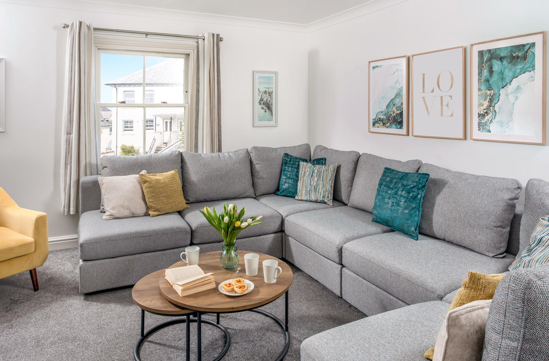 The pastel tones in the sitting room create the perfect stylish base to come back to each day.