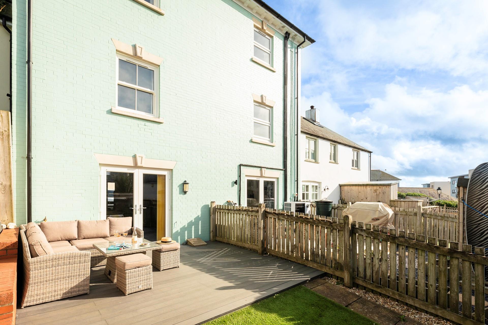 Patio doors open from the kitchen to the decking, perfect for alfresco dining!