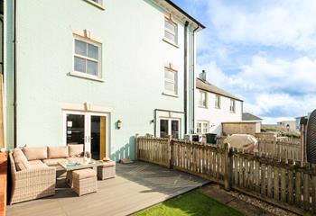 Patio doors open from the kitchen to the decking, perfect for alfresco dining!