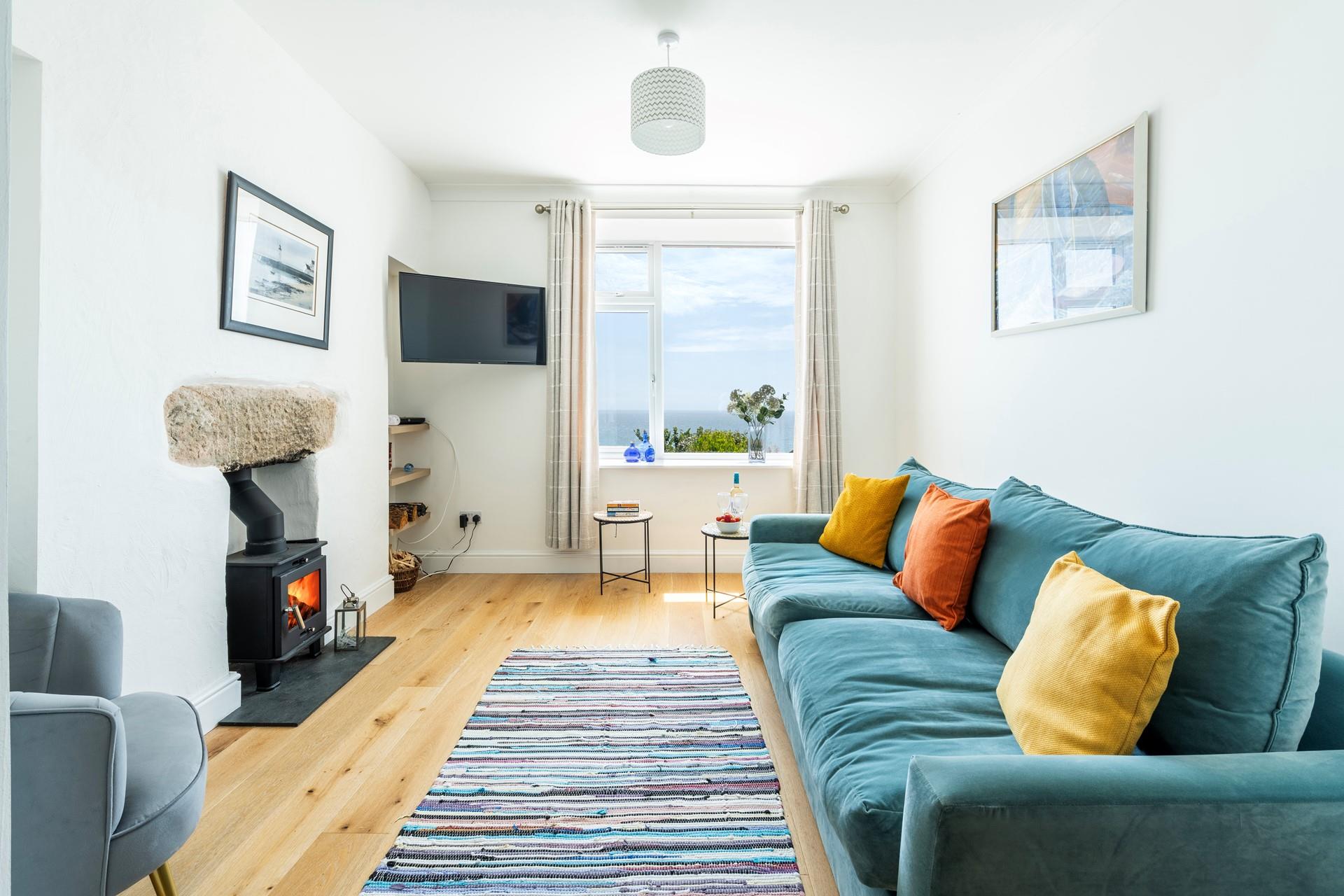 The sitting room is stylishly decorated with bright pops of colour.