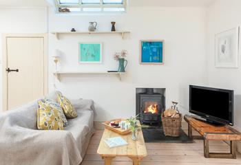 Snuggle up in the sitting room in front of the crackle of the woodburner on chilly evenings.