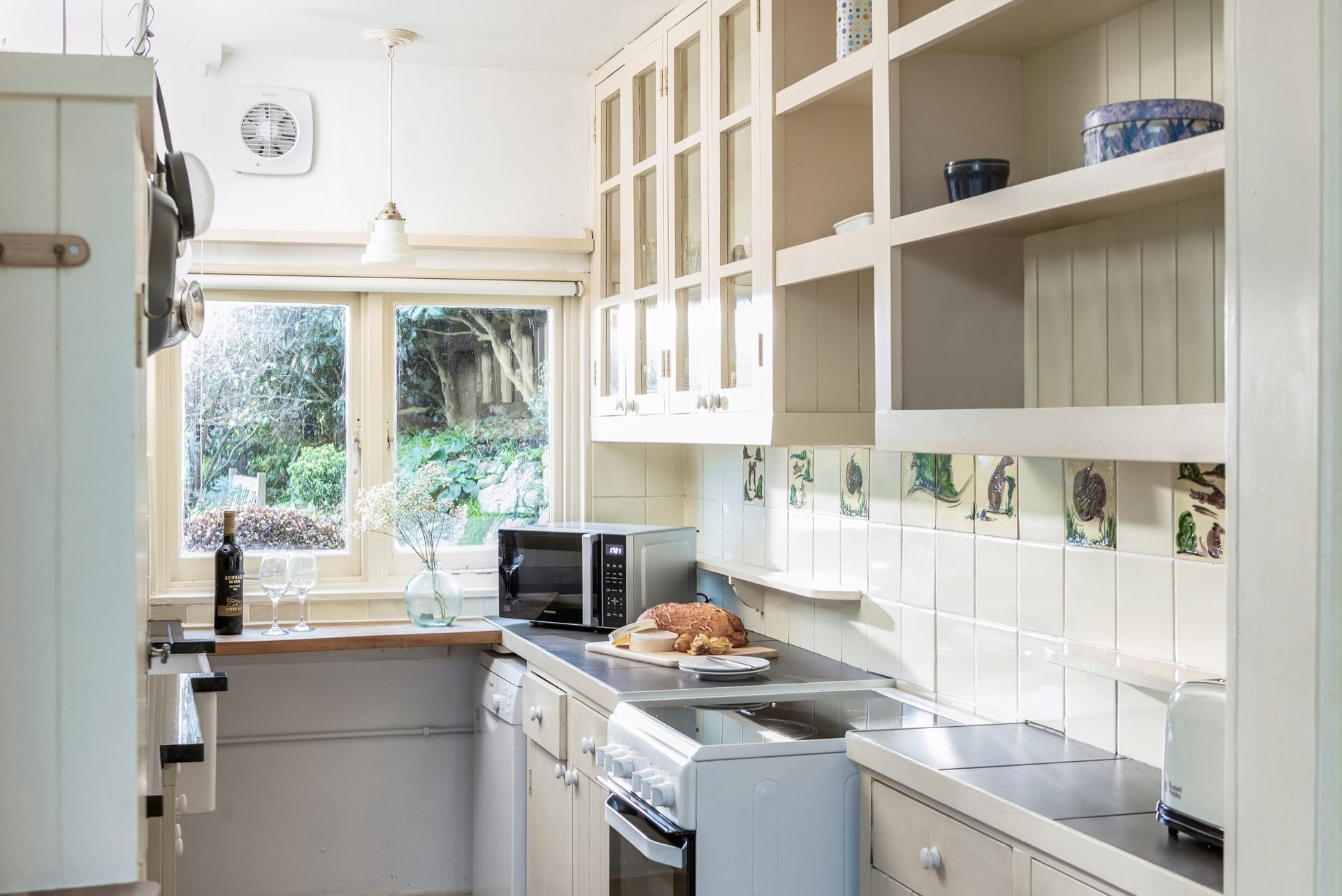 The kitchen has all you need to cook tasty meals and pack picnics for days out.