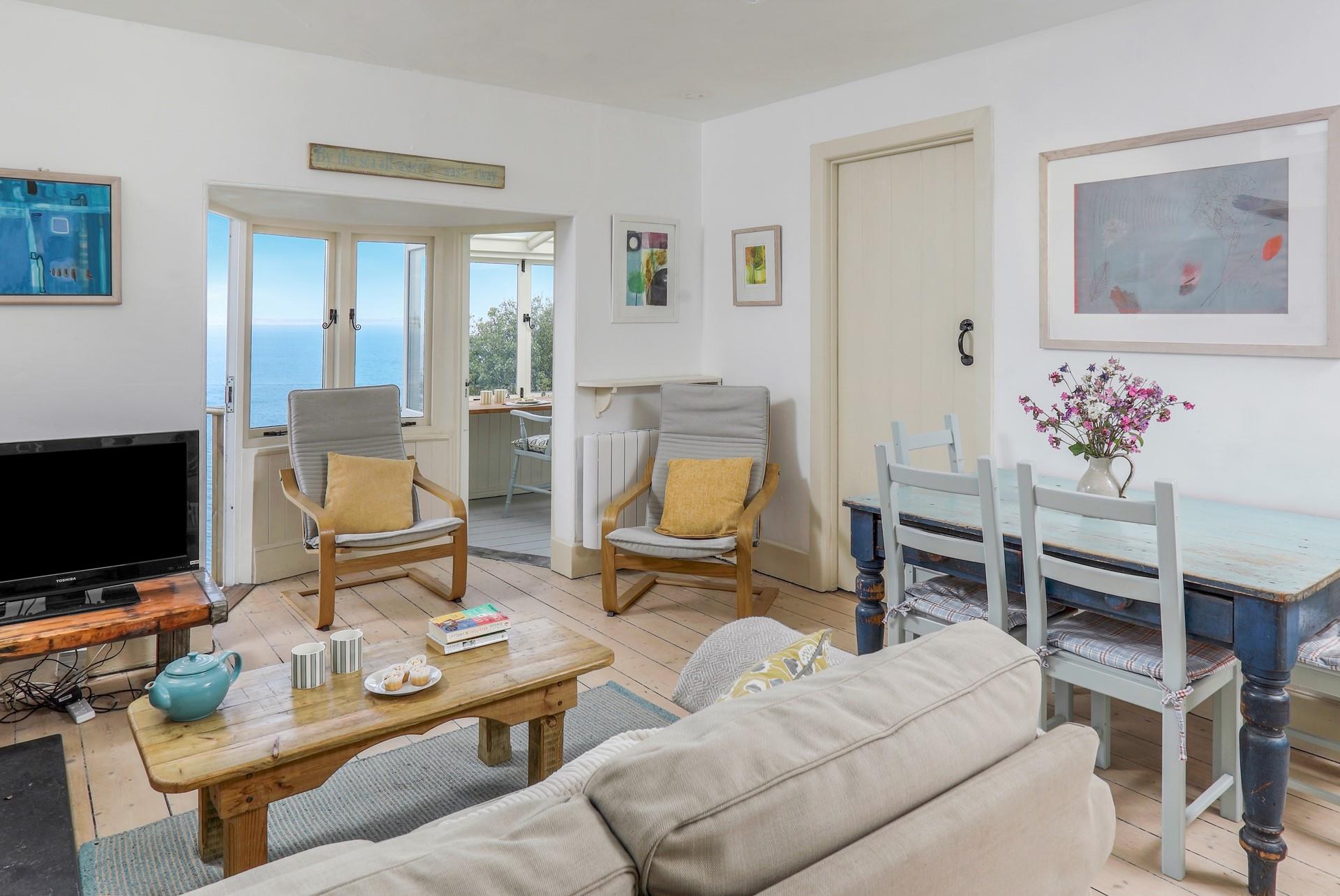 Light and cosy, the sitting room offers you a space to relax as the sun comes down.