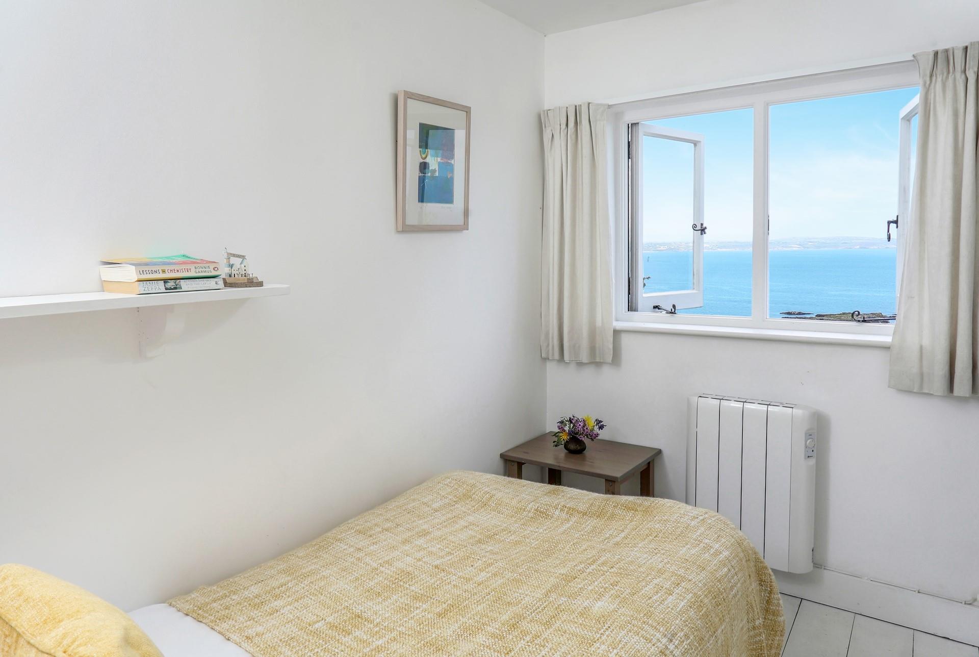 Bedroom 2 has a single bed perfect for adults or children to relax in.