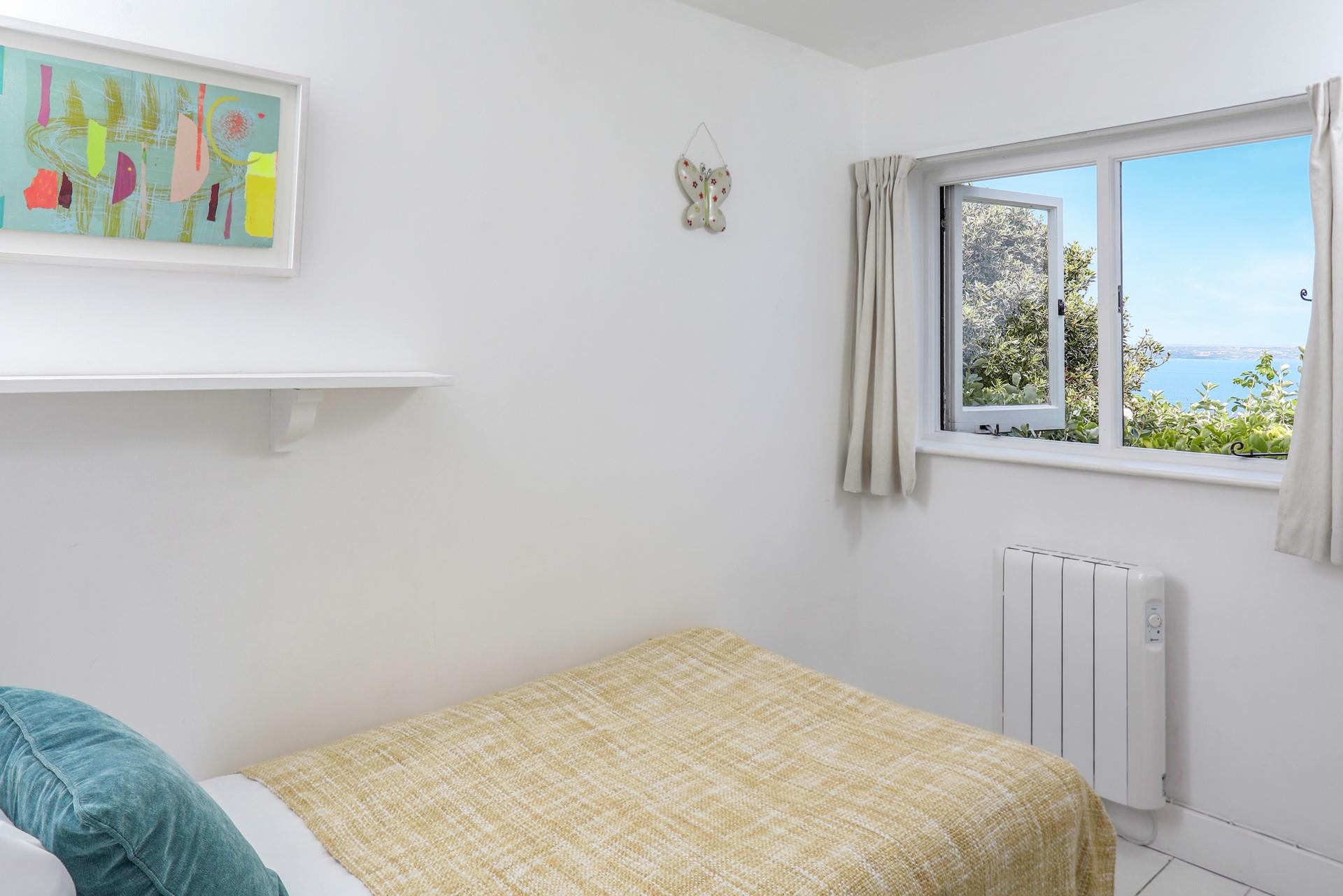 Open the curtains to watch the sunrise over the horizon.