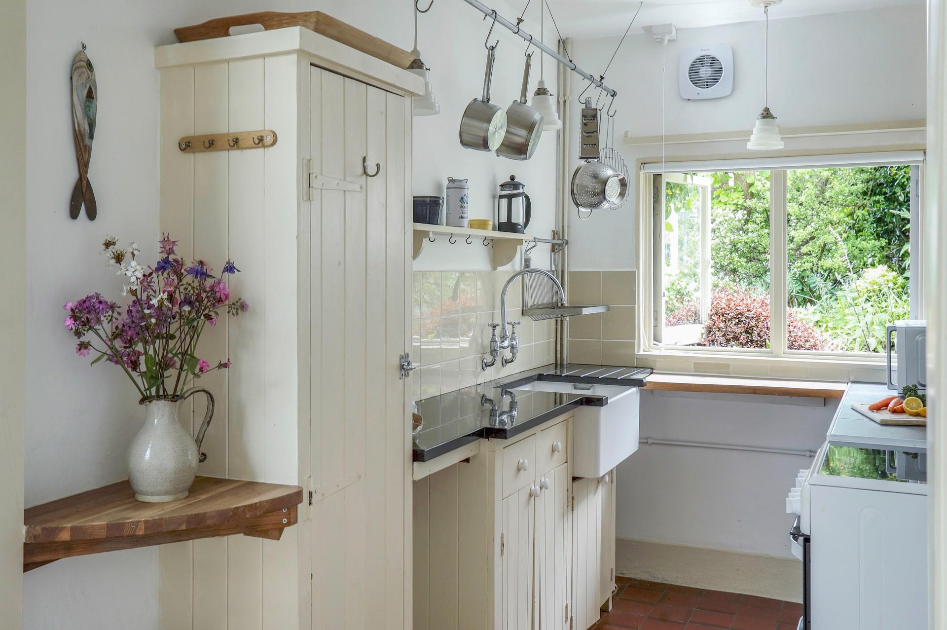 The cottage-style kitchen is well-equipped for cooking up a storm.