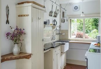 The cottage-style kitchen is well-equipped for cooking up a storm.