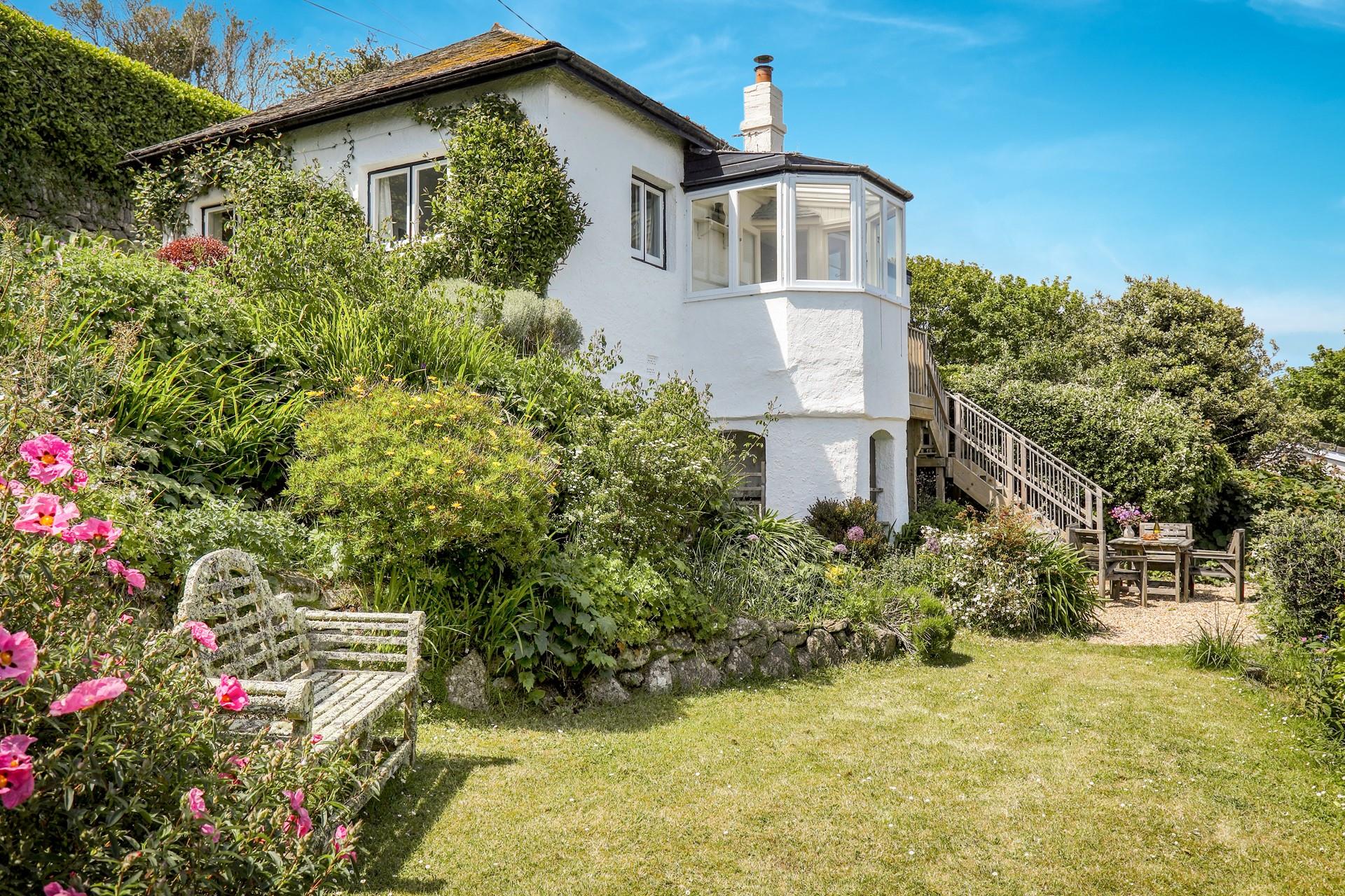 Sip a glass of wine in the well-established gardens.