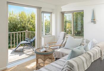 Open the balcony doors and enjoy a mix of indoor and outdoor living in the summer months.