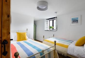The little ones will love the colourful twin room and beach hut style wardrobe.