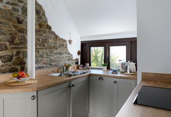The barn conversion is characterful with its exposed brick wall and beams.