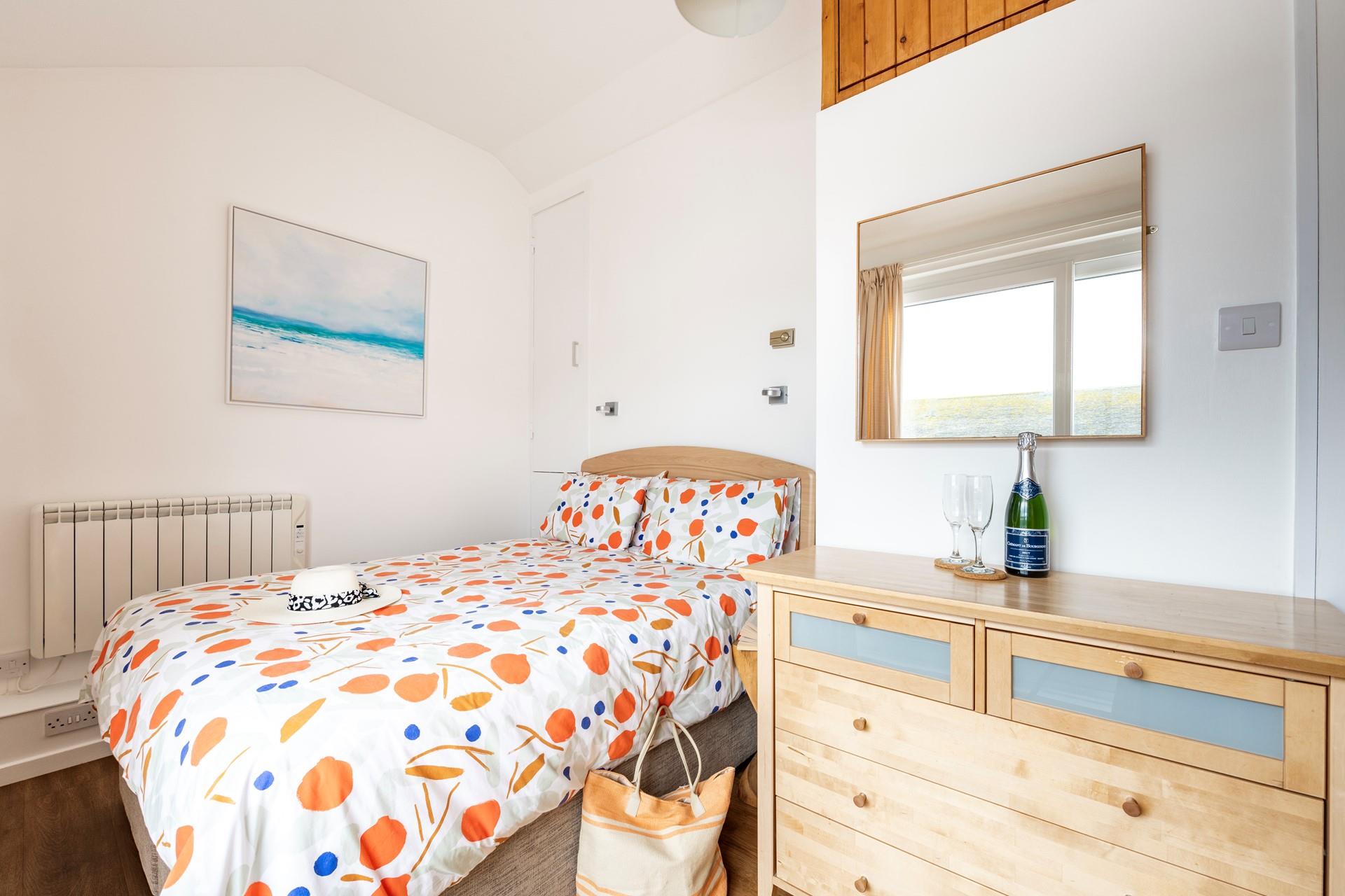 Settle into the soft sheets of the king size bed and drift into a dreamy night's slumber.