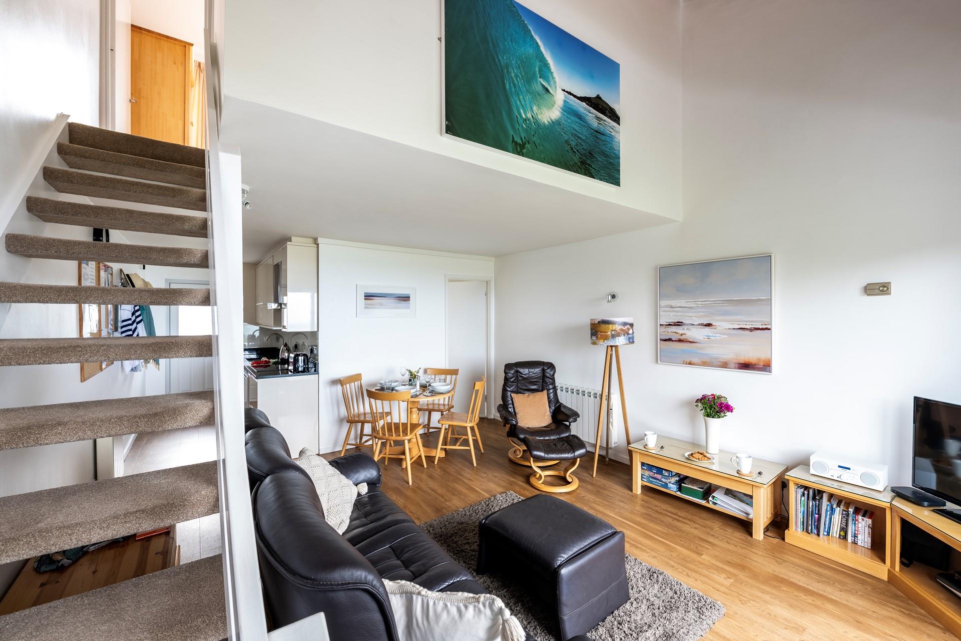 Climb the stairs to the bedroom after an evening on the balcony.