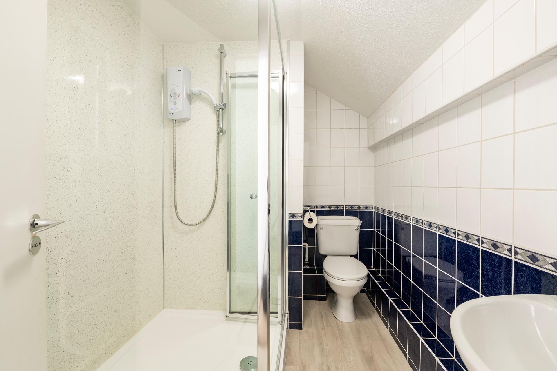 Wash off sandy toes in the shower after a day on the beach.