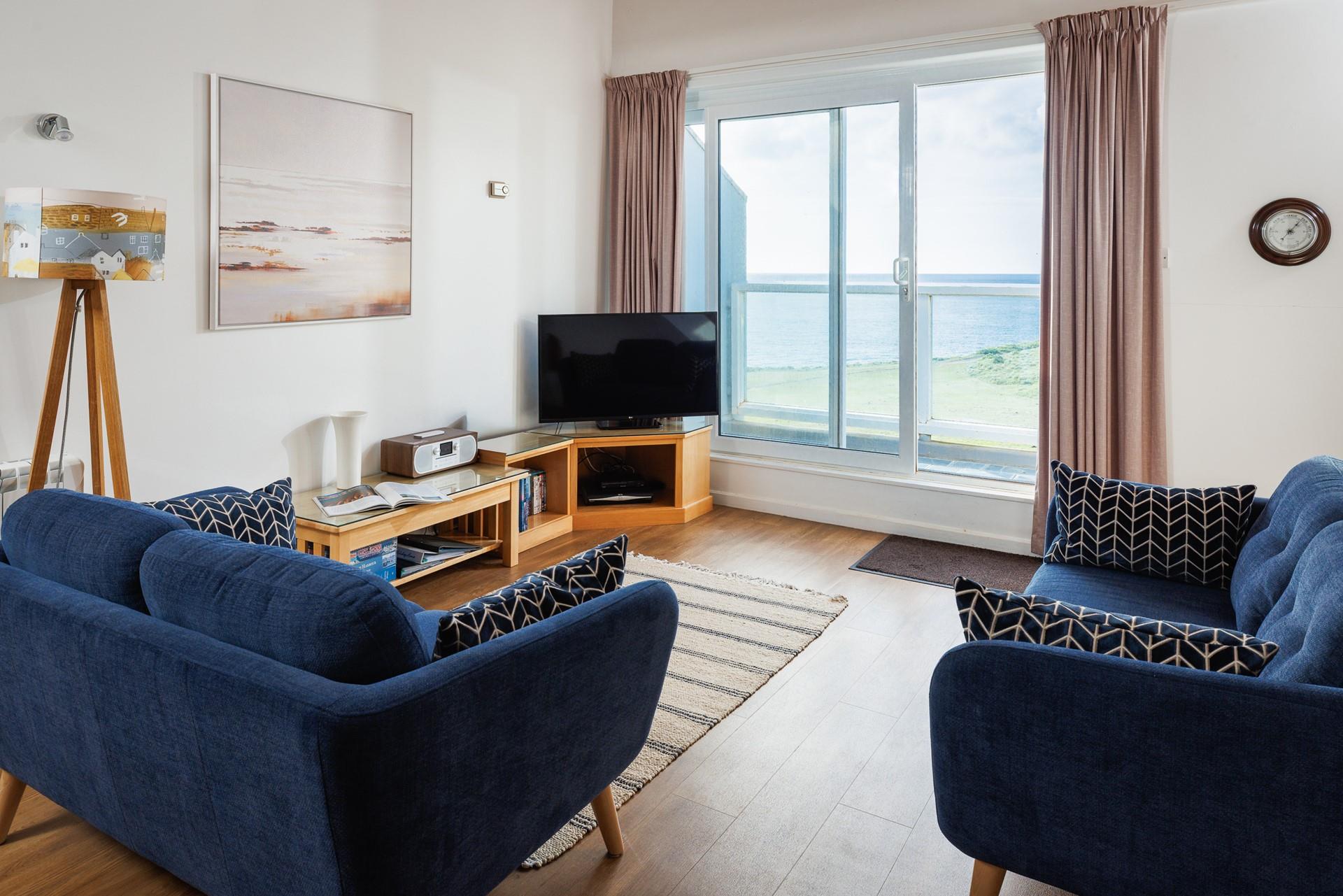 Open the patio doors to let the fresh sea breeze into the apartment.