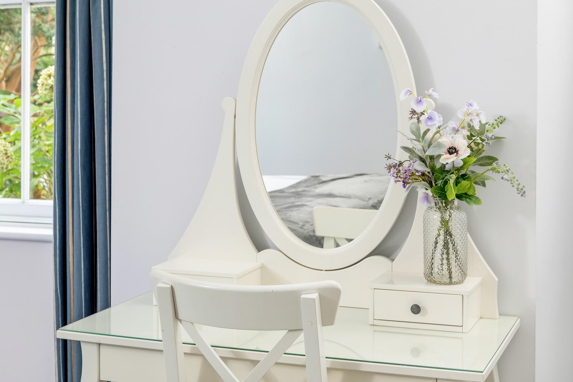 Get ready for the day at the lovely dressing table.