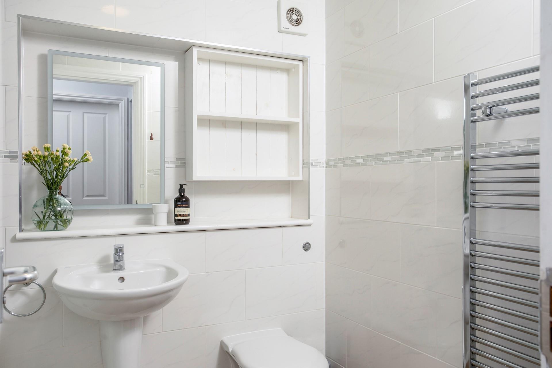 Warm fluffy towels can be taken straight from the heated towel rail after a shower.
