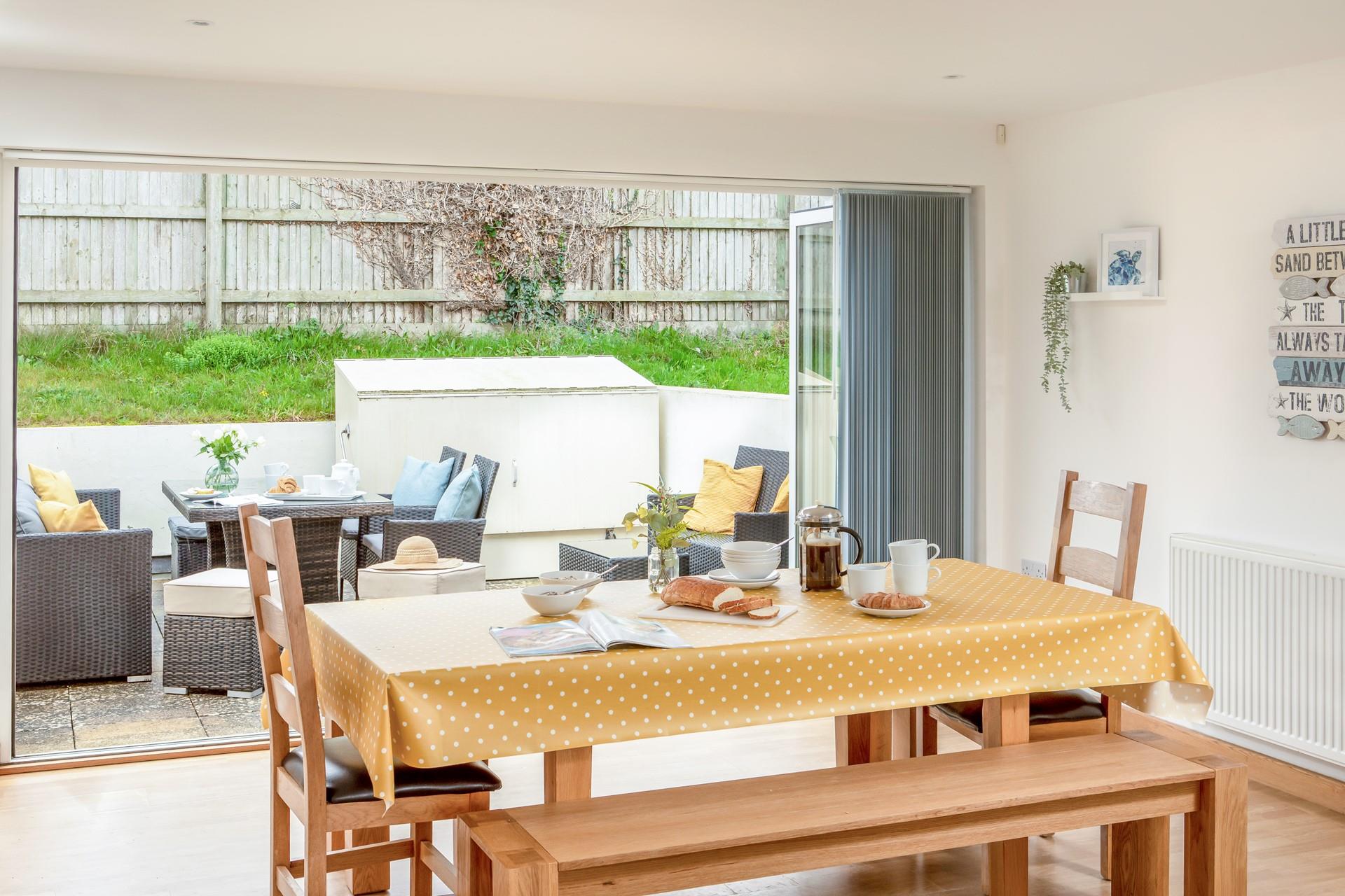 With the doors open out onto the patio, the whole family can enjoy spending quality time together. 