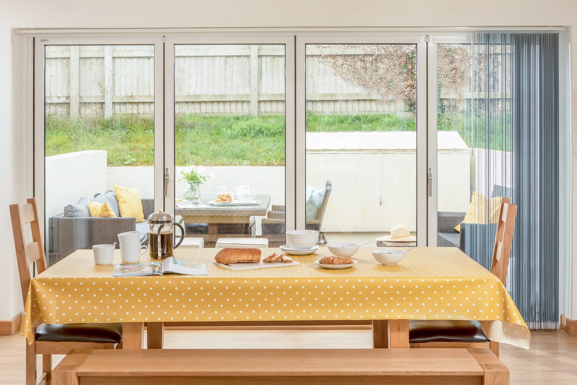 Bi fold doors open out to a private, enclosed patio, which is perfect for al fresco dining on a summer's eve.