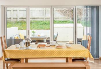 Bi fold doors open out to a private, enclosed patio, which is perfect for al fresco dining on a summer's eve.