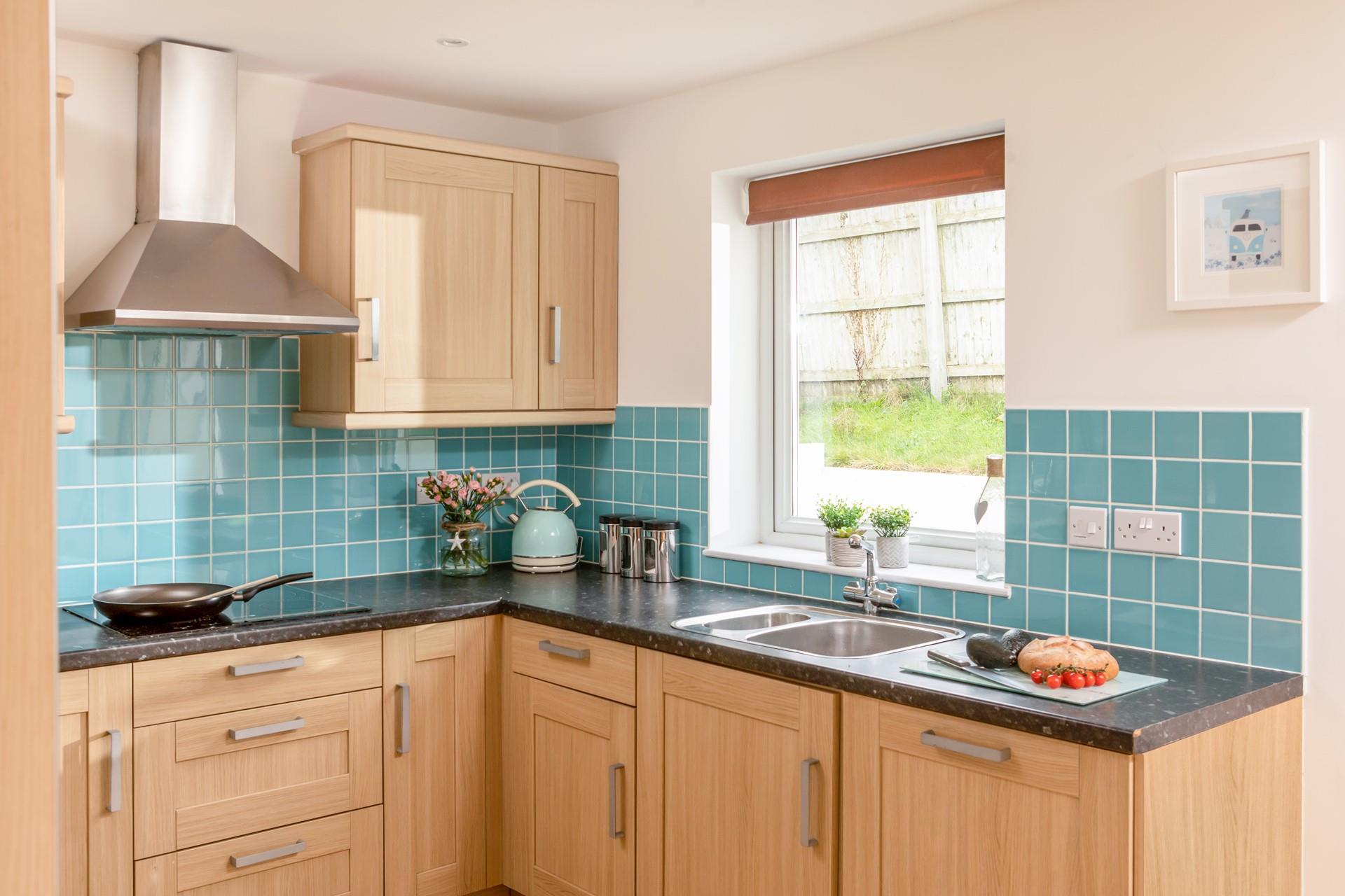 The kitchen is open plan to the dining area, making serving delicious dinners a breeze.