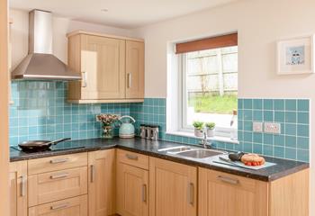 The kitchen is open plan to the dining area, making serving delicious dinners a breeze.